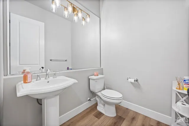 a view of a hallway with bathroom