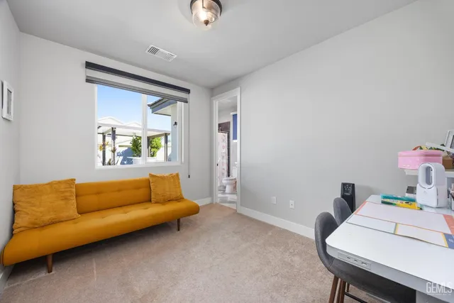 a view of a patio with swimming pool table and chairs