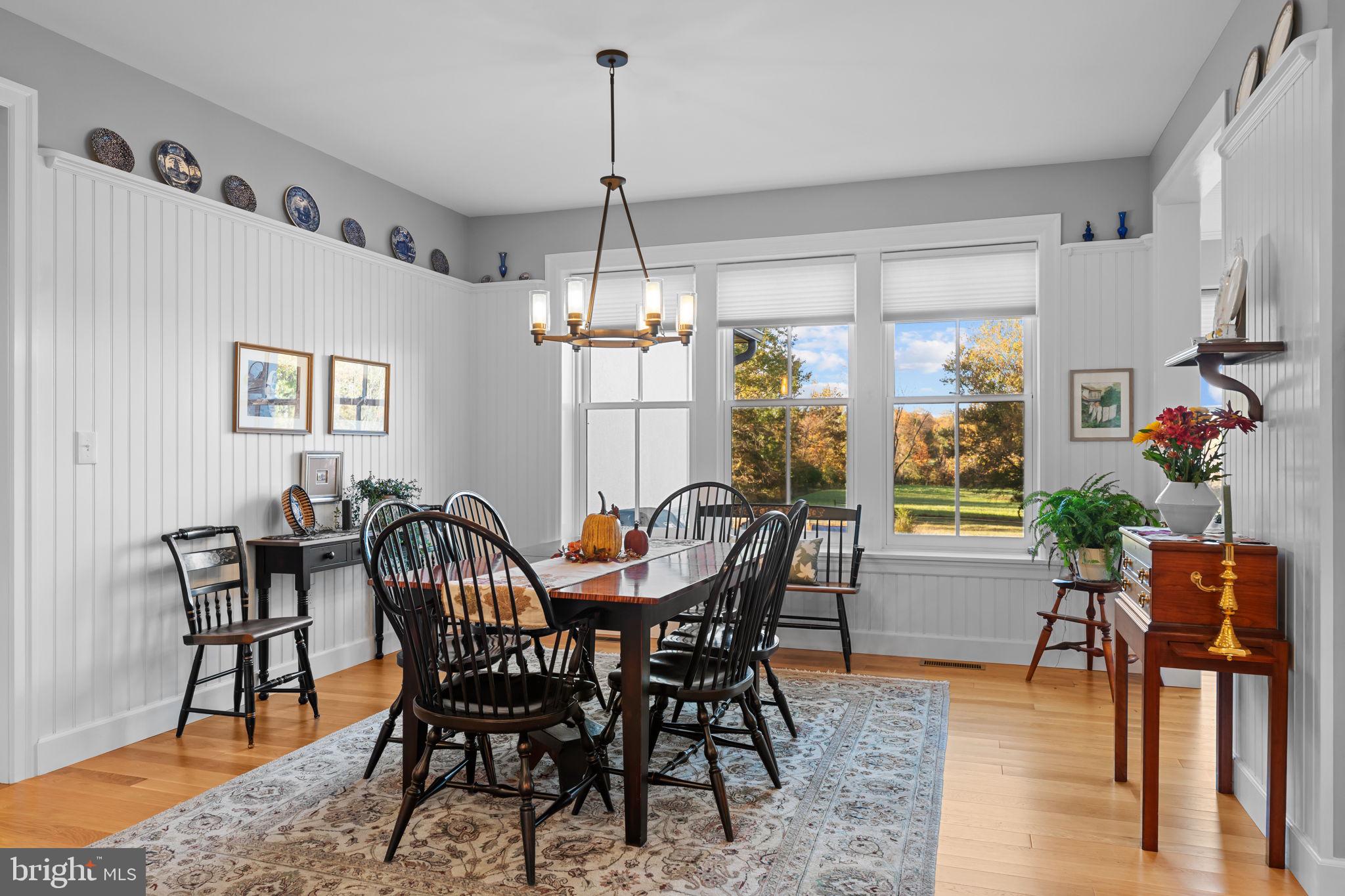 675 West Seven Stars Road Phoenixville, PA 19460 - Photo 12 of 45 a view of a dining room with furniture window and wooden floor