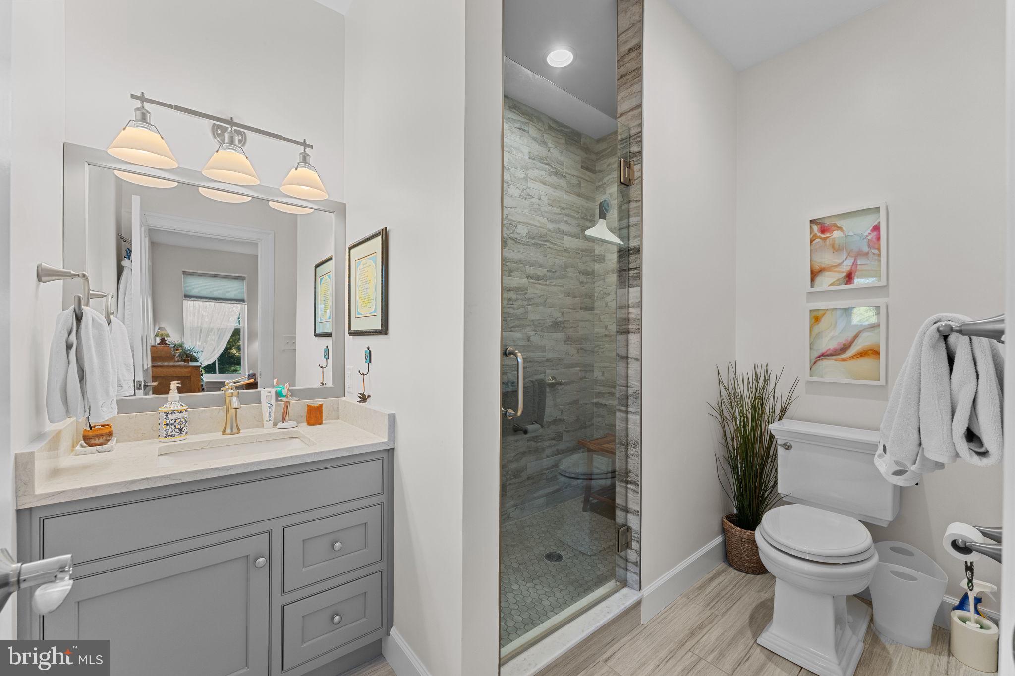 675 West Seven Stars Road Phoenixville, PA 19460 - Photo 27 of 45 a bathroom with a sink mirror vanity and toilet