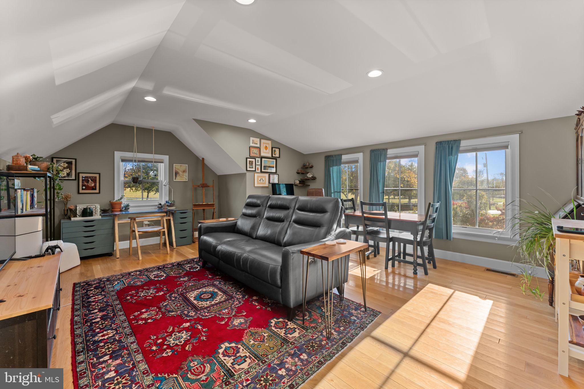 675 West Seven Stars Road Phoenixville, PA 19460 - Photo 32 of 45 a living room with furniture a rug and a table