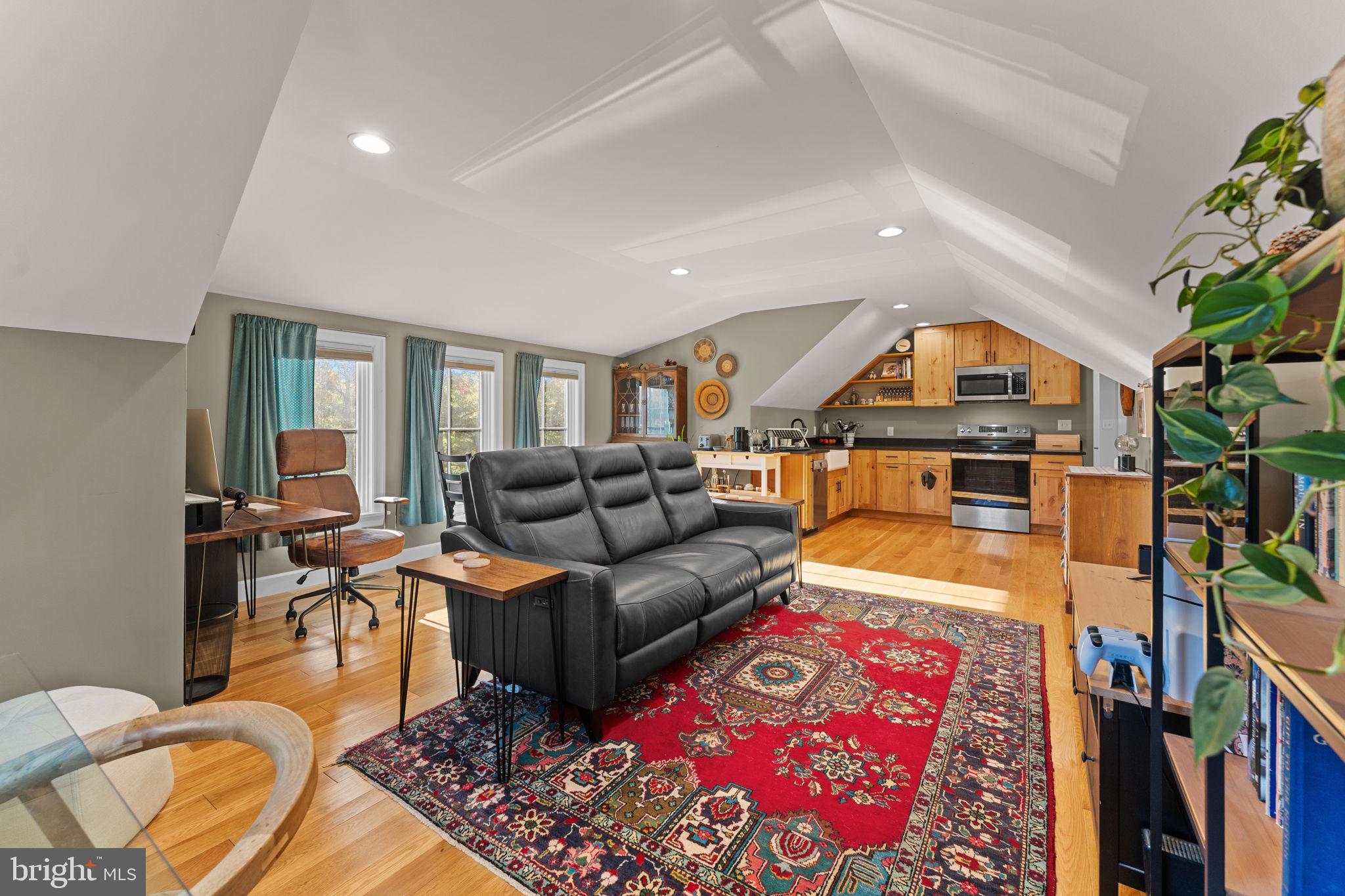 675 West Seven Stars Road Phoenixville, PA 19460 - Photo 33 of 45 a living room with furniture a rug and a table