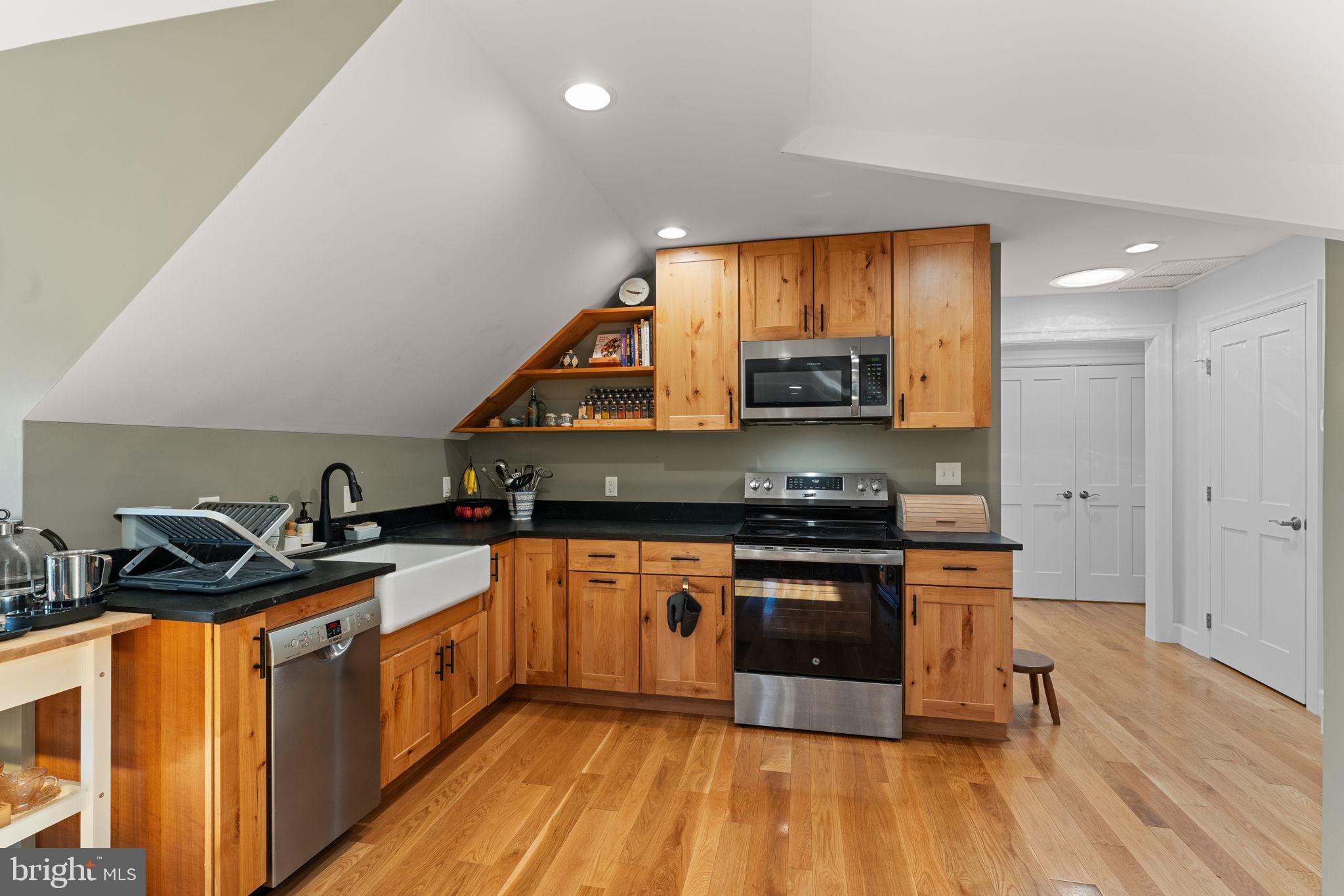 675 West Seven Stars Road Phoenixville, PA 19460 - Photo 34 of 45 a kitchen with stainless steel appliances granite countertop a stove a sink and a microwave