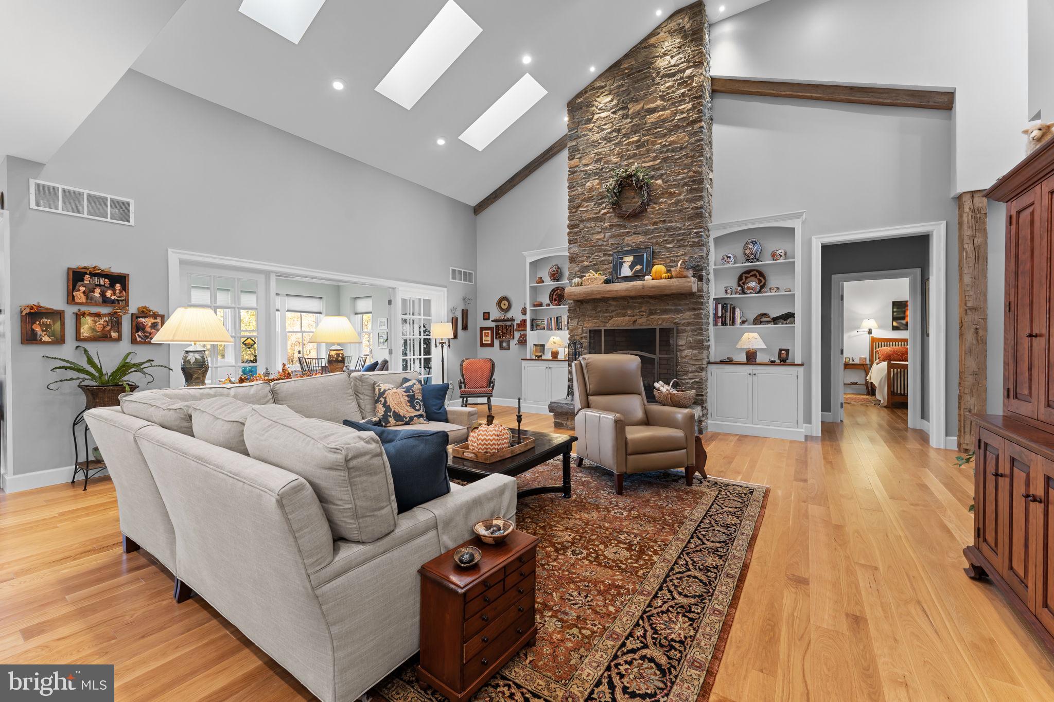 675 West Seven Stars Road Phoenixville, PA 19460 - Photo 8 of 45 a living room with furniture and a fireplace