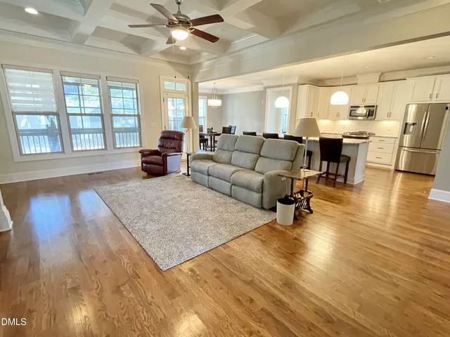 a living room with a fireplace and a flat screen tv