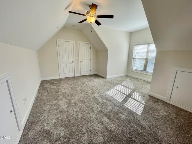 a view of a park with swings and a fire hydrant