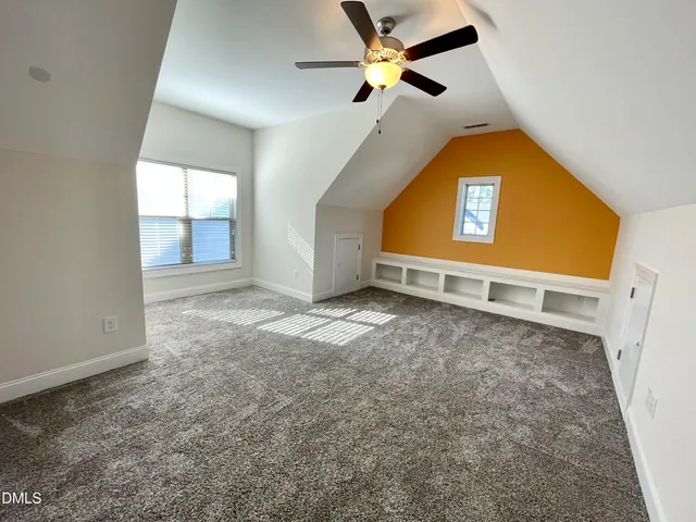 a view of an house with backyard and sitting area