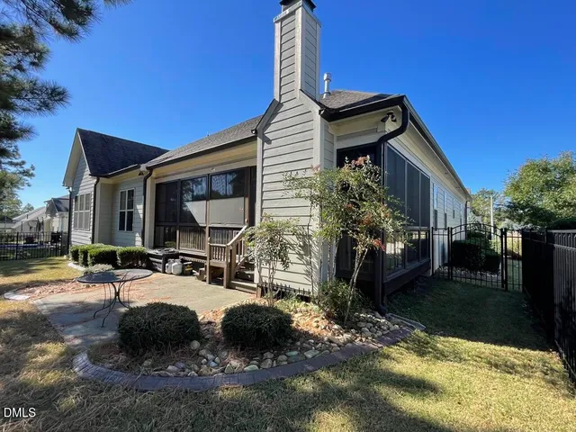 a view of a room with a ceiling fan