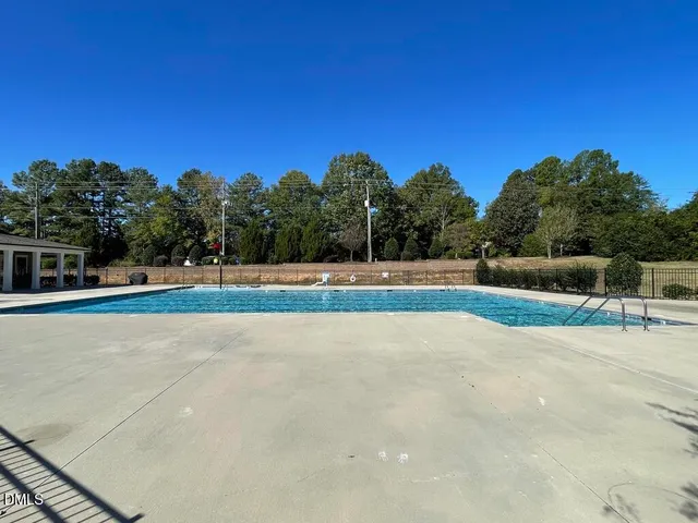 a bathroom with a tub shower and sink