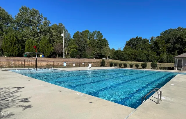 a bathroom with double vanity sinks and a mirror