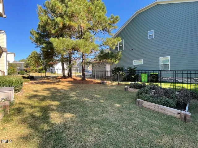 a living room with furniture and floor to ceiling window
