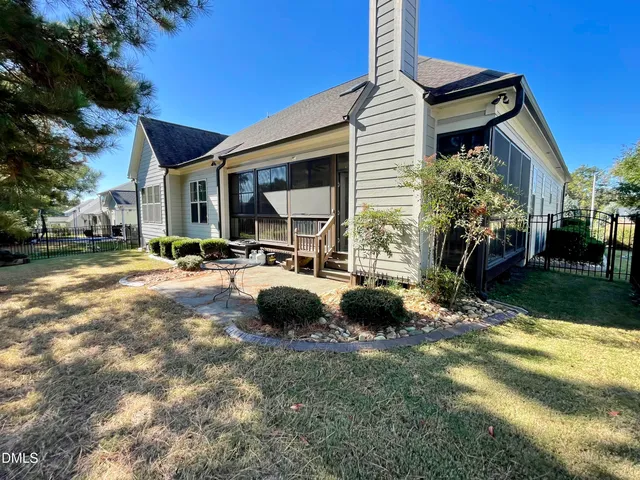 a view of livingroom with a ceiling fan and a window