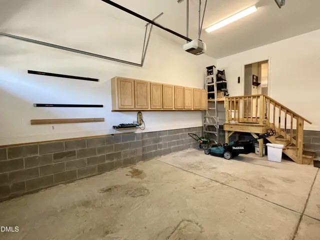 a living room with a bed and a window