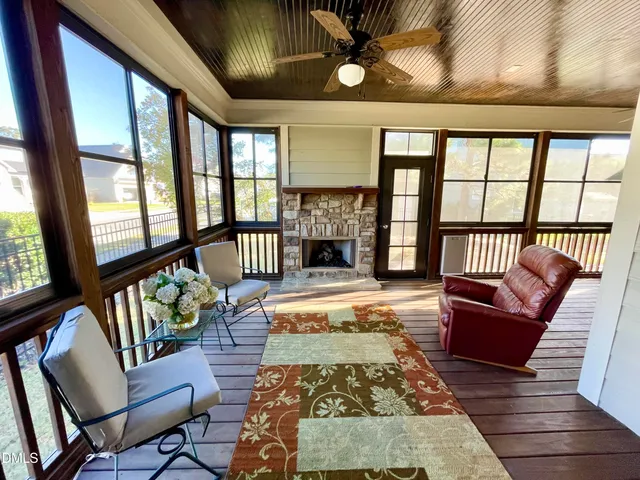 a large white kitchen with lots of counter space a sink and appliances