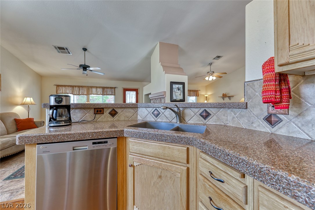 2001 Appaloosa Road Henderson, NV 89002 - Photo 20 of 44 This bright kitchen features durable countertops, a double-basin sink, and modern stainless steel appliances.