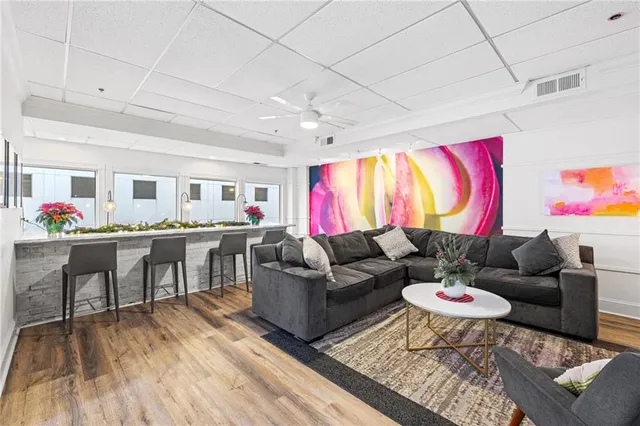 a front view of a building with a garden