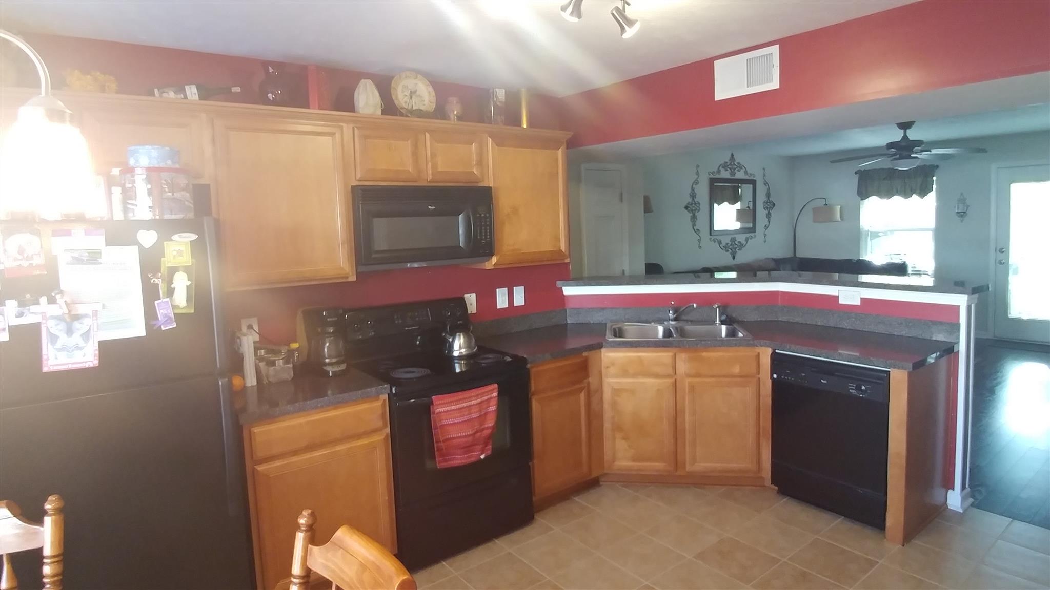 3023 London View Murfreesboro, TN 37128 - Photo 5 of 13 a kitchen with stainless steel appliances granite countertop a stove top oven