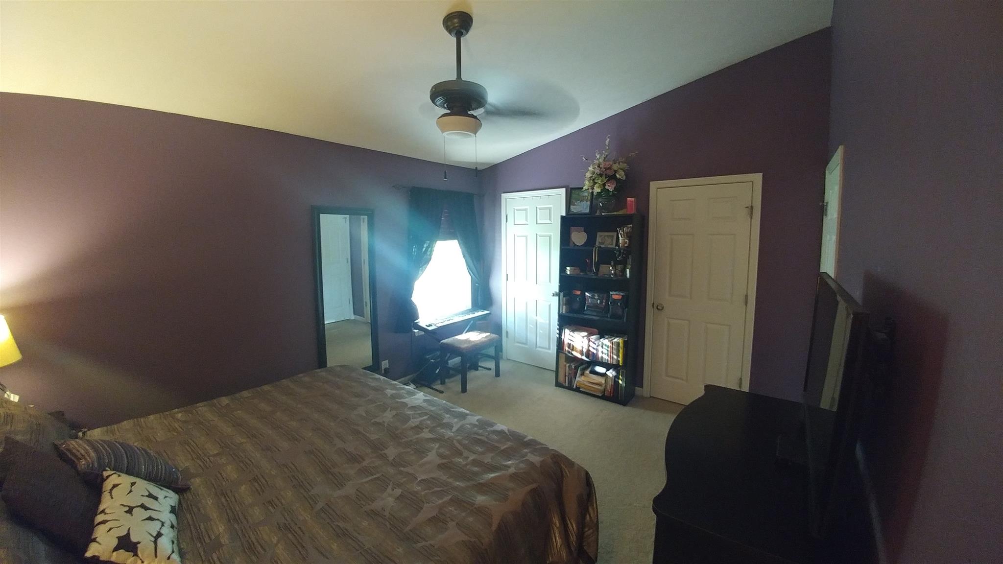 3023 London View Murfreesboro, TN 37128 - Photo 10 of 13 a bedroom with a bed and a chandelier