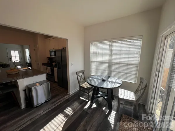 a view of a room with furniture and window