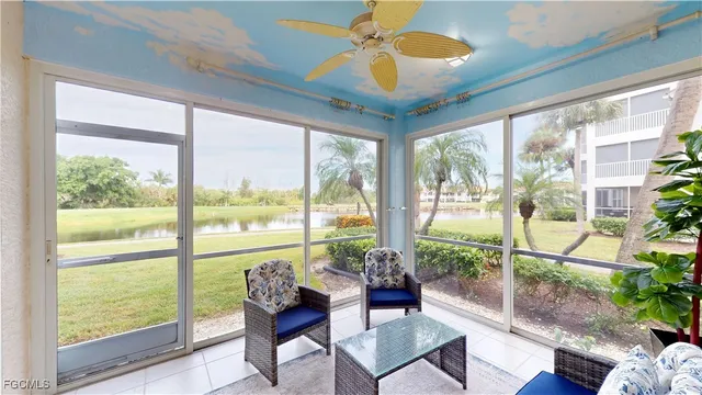 a view of a livingroom with furniture and a large window