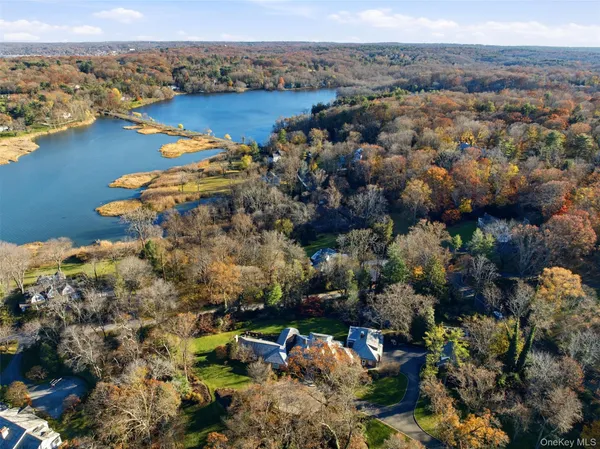 an aerial view of a houses with a yard