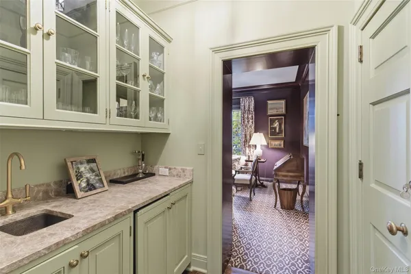 a kitchen with a sink and cabinets