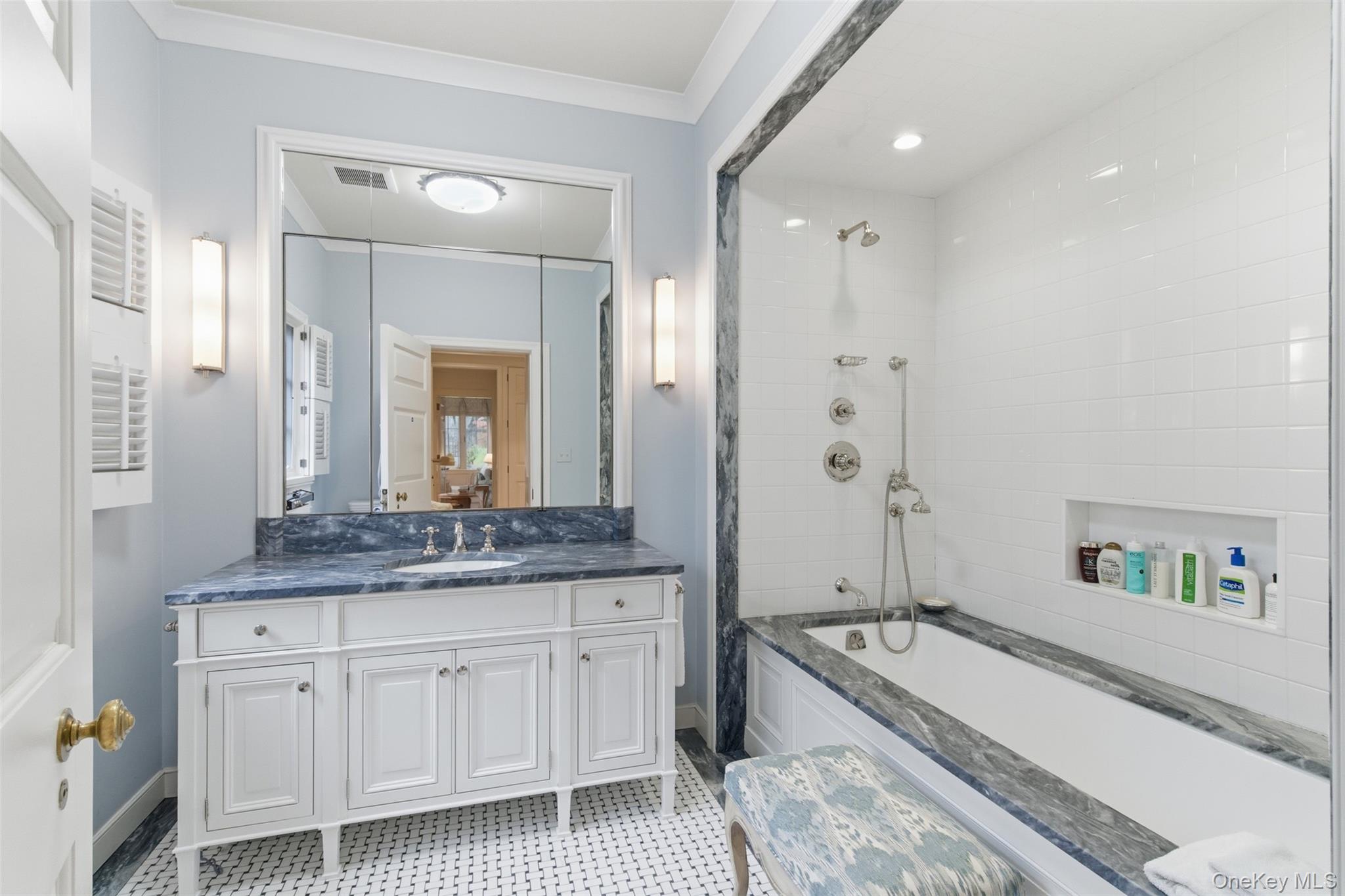 159 Factory Pond Road Mill Neck, NY 11560 - Photo 25 of 39 a spacious bathroom with a granite countertop tub sink and mirror