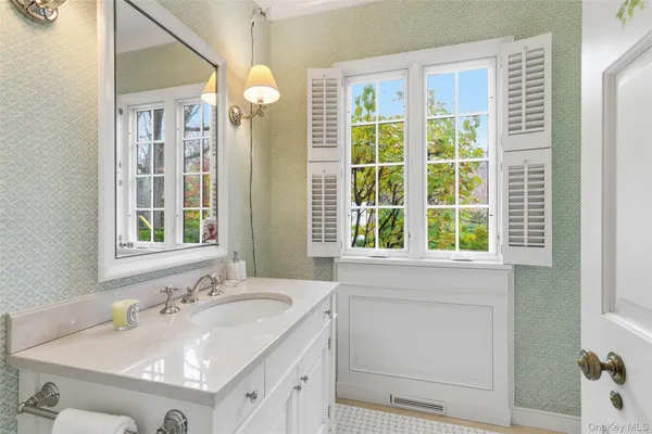 a bathroom with a sink and a mirror