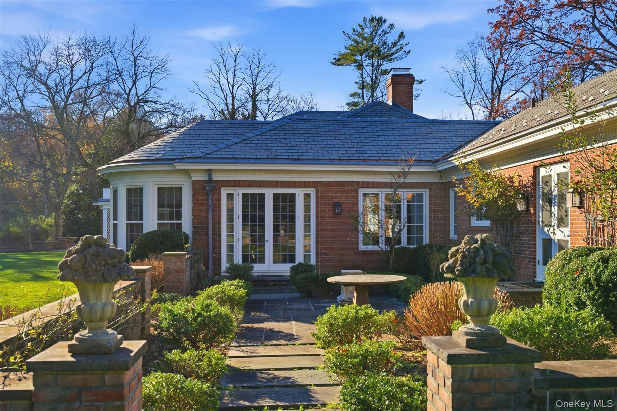 159 Factory Pond Road Mill Neck, NY 11560 - Photo 35 of 39 a front view of house with yard and outdoor seating