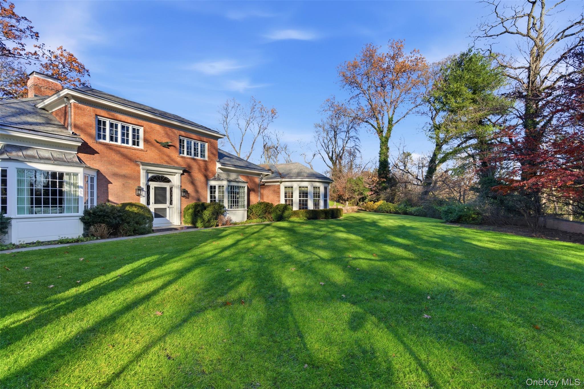 159 Factory Pond Road Mill Neck, NY 11560 - Photo 37 of 39 a front view of a house with a yard