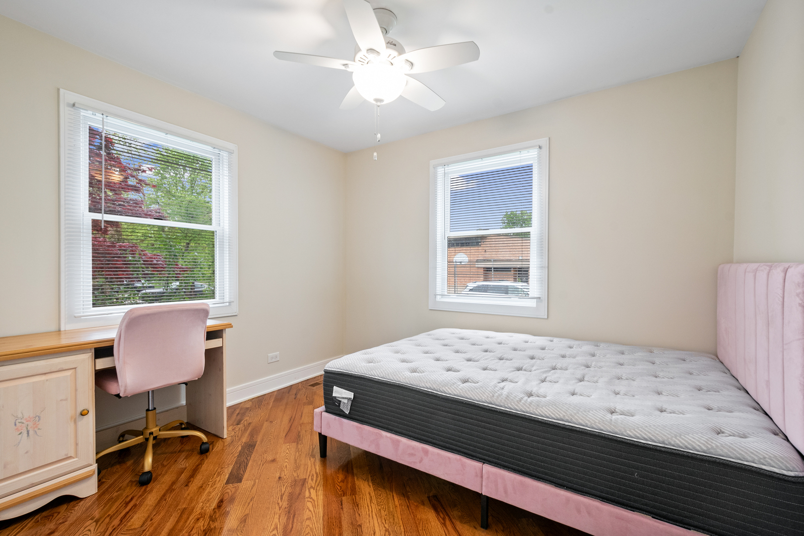 3755 Grove Street, Unit 1 Skokie, IL 60076 - Photo 12 of 24 a bedroom with a bed and a chair