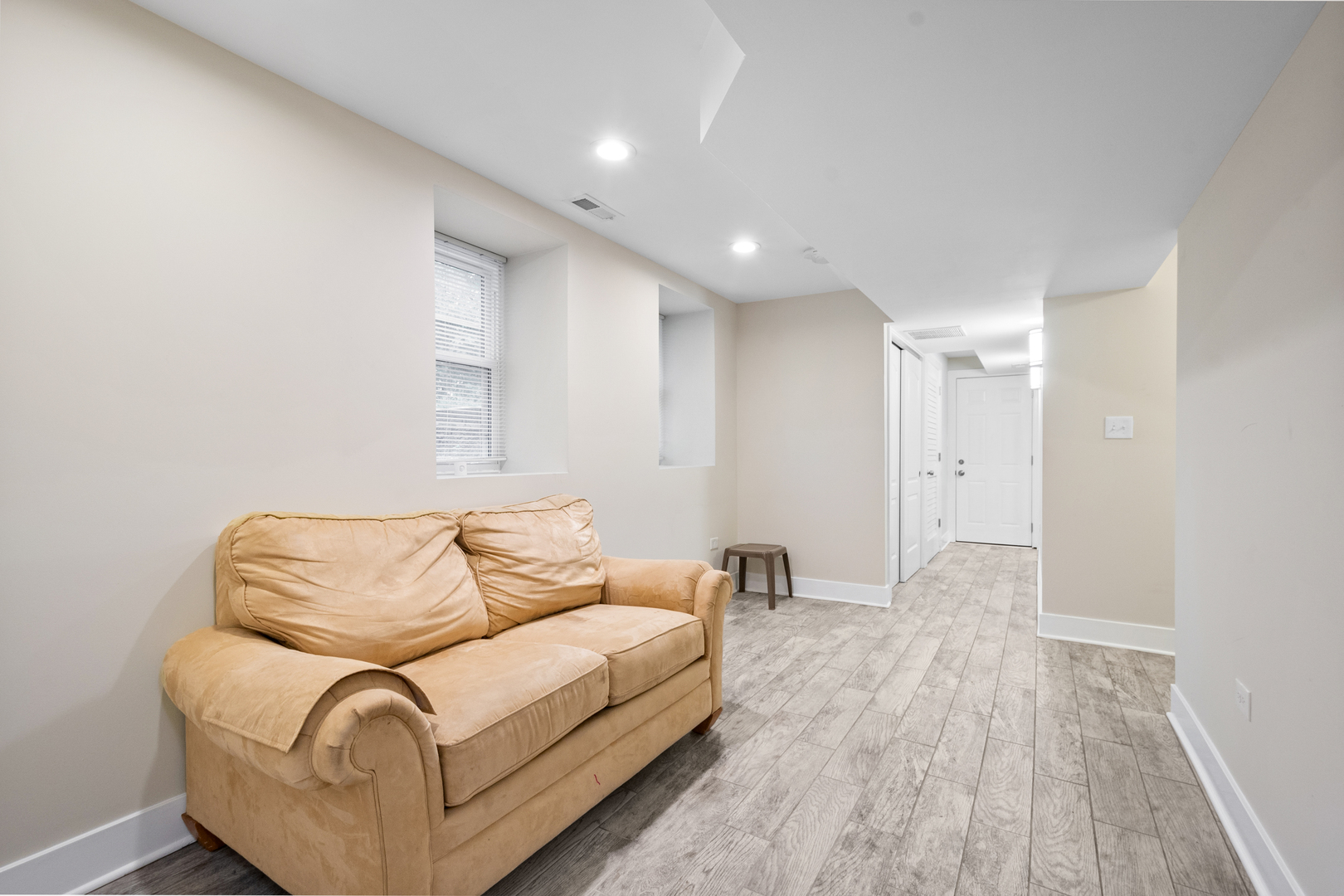 3755 Grove Street, Unit 1 Skokie, IL 60076 - Photo 14 of 24 a living room with furniture and a wooden floor