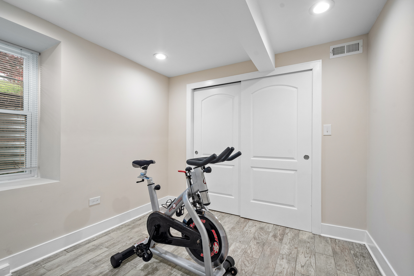 3755 Grove Street, Unit 1 Skokie, IL 60076 - Photo 18 of 24 a view of a room with gym equipment