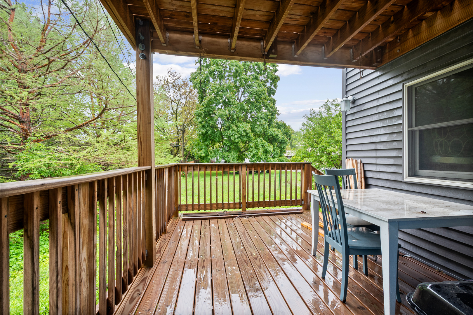 3755 Grove Street, Unit 1 Skokie, IL 60076 - Photo 21 of 24 a balcony with wooden floor in outdoor space