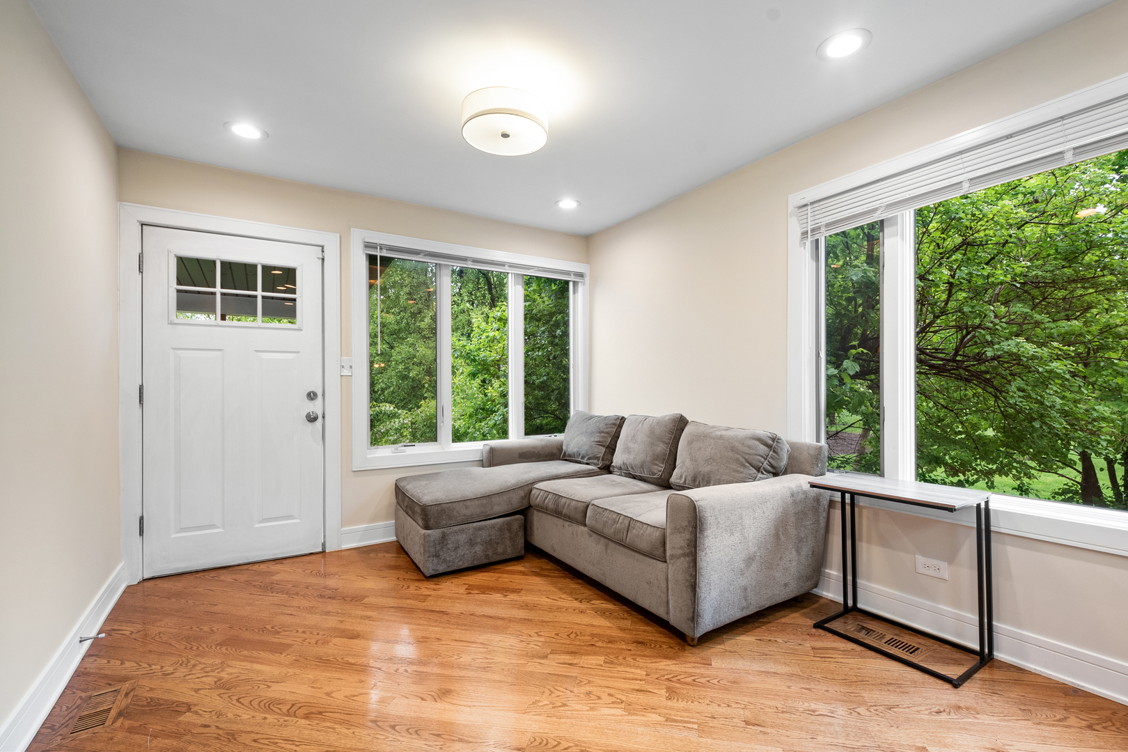 3755 Grove Street, Unit 1 Skokie, IL 60076 - Photo 4 of 24 a living room with furniture and large windows
