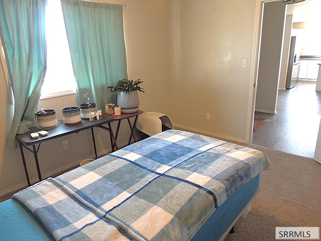 27 North White Pne Lane Rigby, ID 83442 - Photo 17 of 25 Bedroom 2 - large east window
