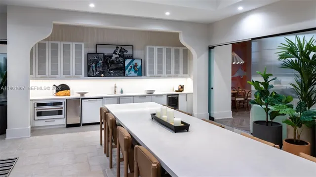 a kitchen with a refrigerator and a sink