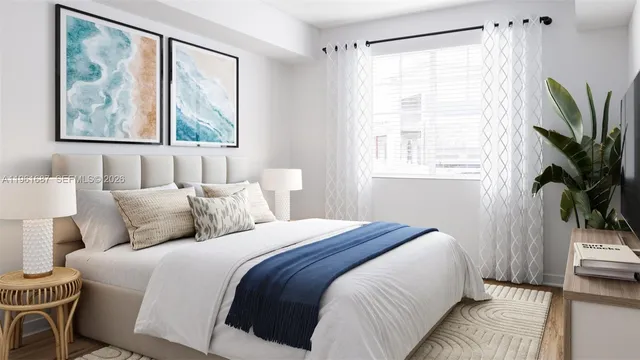 a bedroom with a bed and a large window