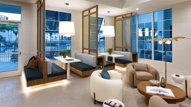 a living room with furniture and large window