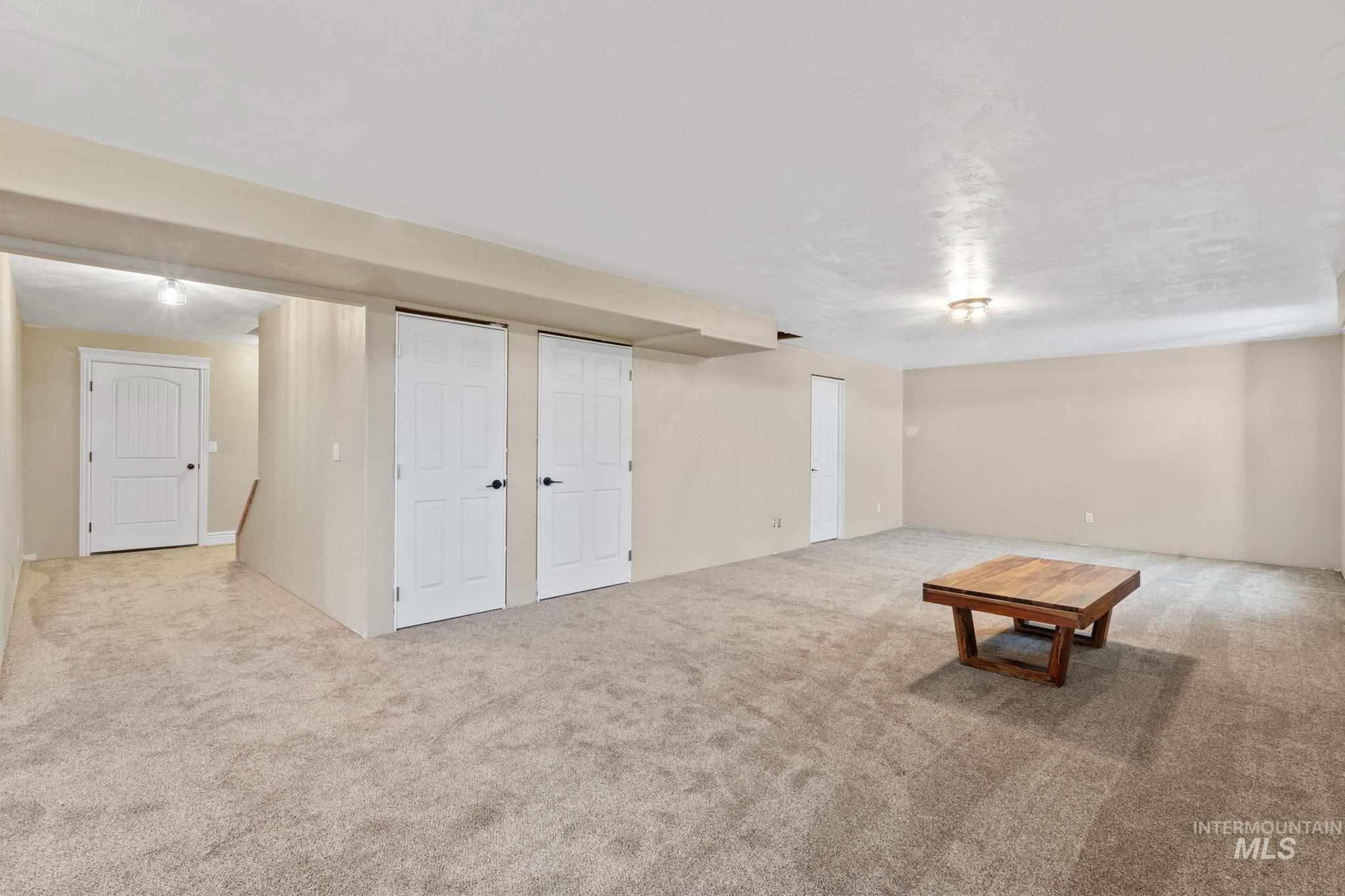 3625 North 2000 West Rexburg, ID 83440 - Photo 19 of 50 Finished below grade area featuring carpet flooring