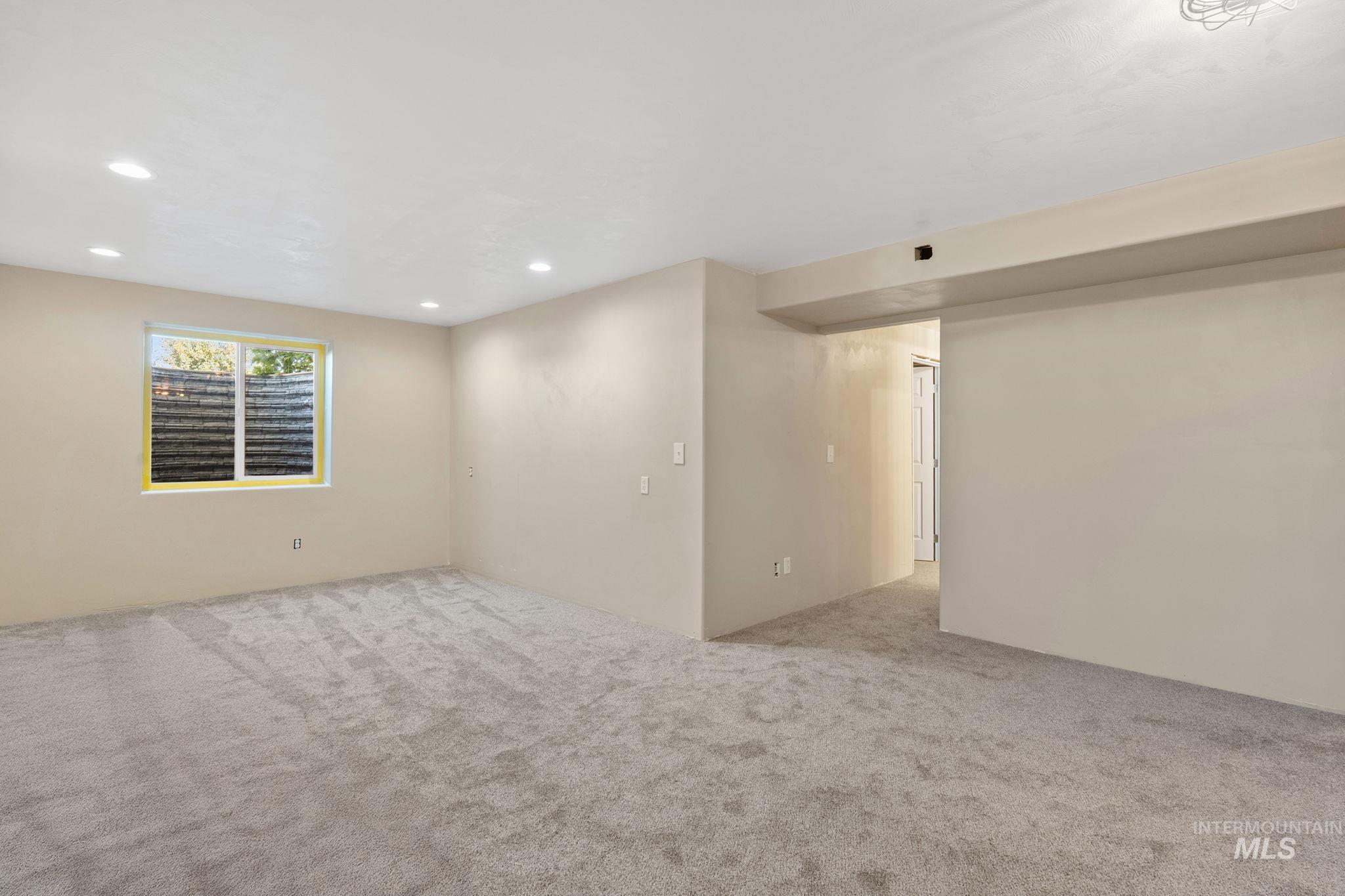 3625 North 2000 West Rexburg, ID 83440 - Photo 21 of 50 Spare room featuring light carpet and recessed lighting