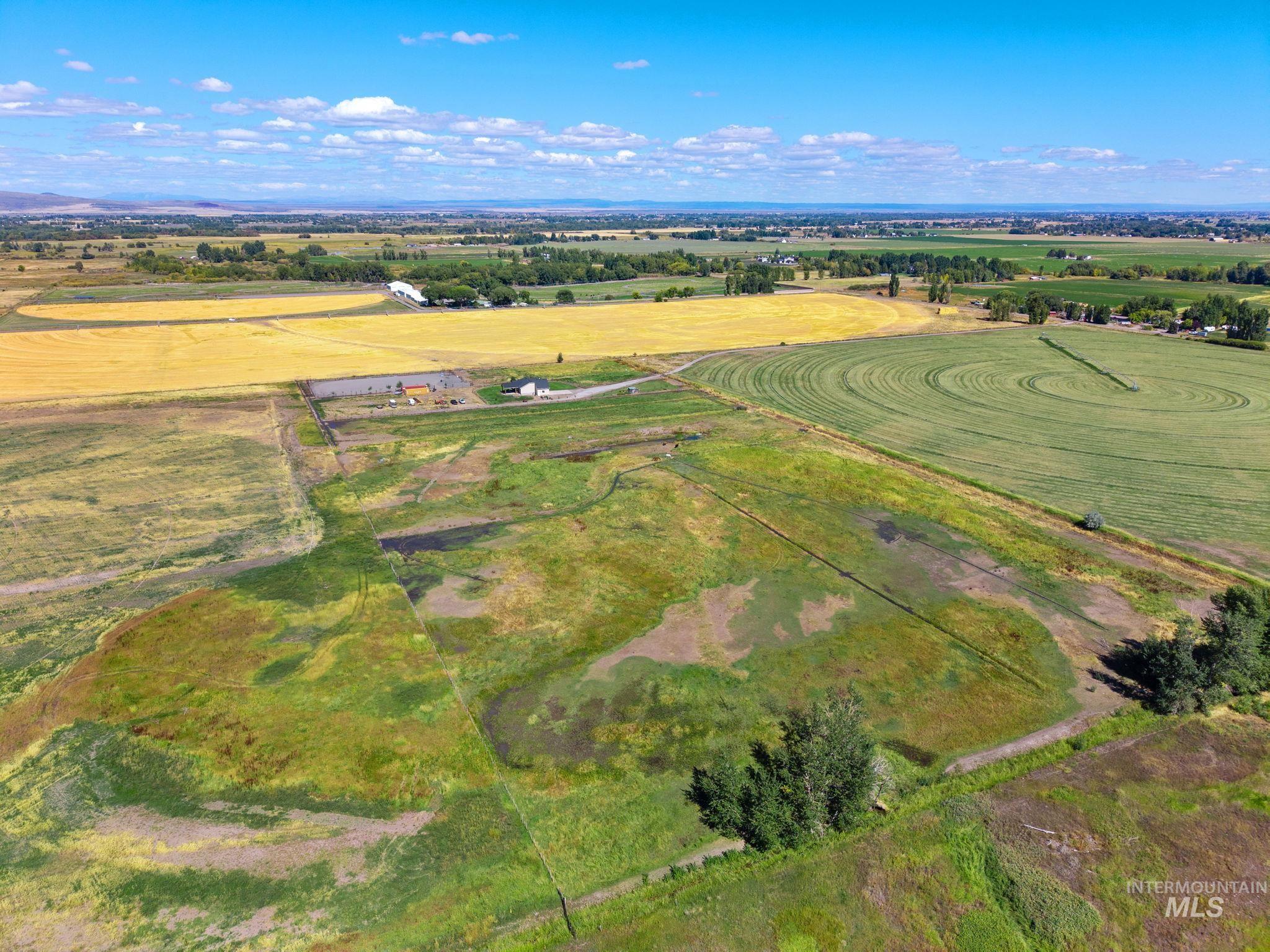 3625 North 2000 West Rexburg, ID 83440 - Photo 42 of 50 Aerial view of property and surrounding area with rural landscape