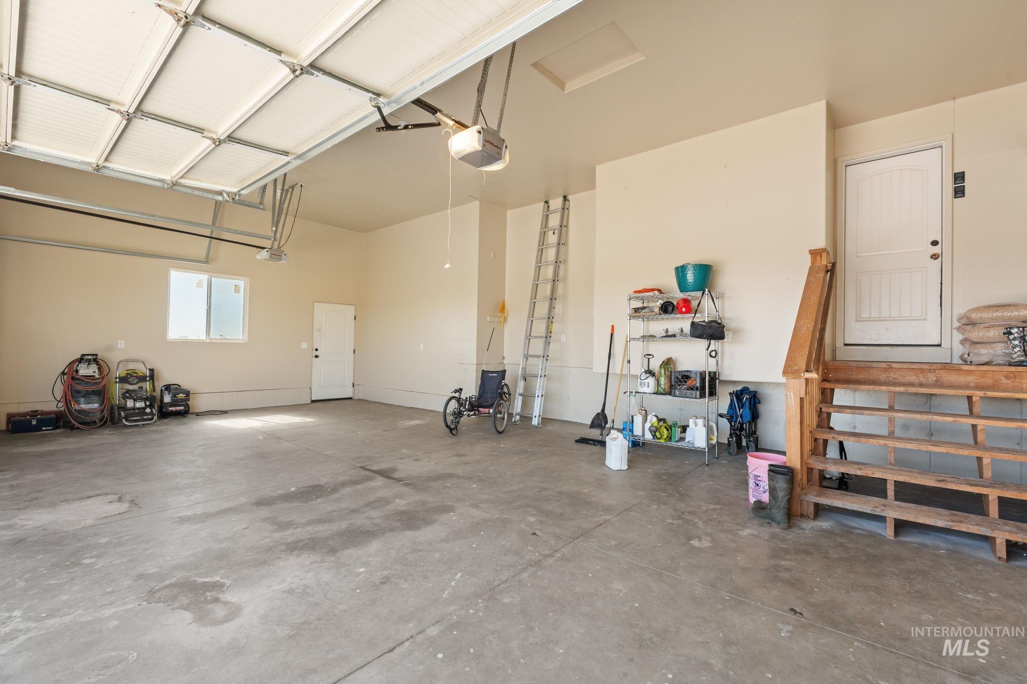 3625 North 2000 West Rexburg, ID 83440 - Photo 5 of 50 Garage featuring a garage door opener