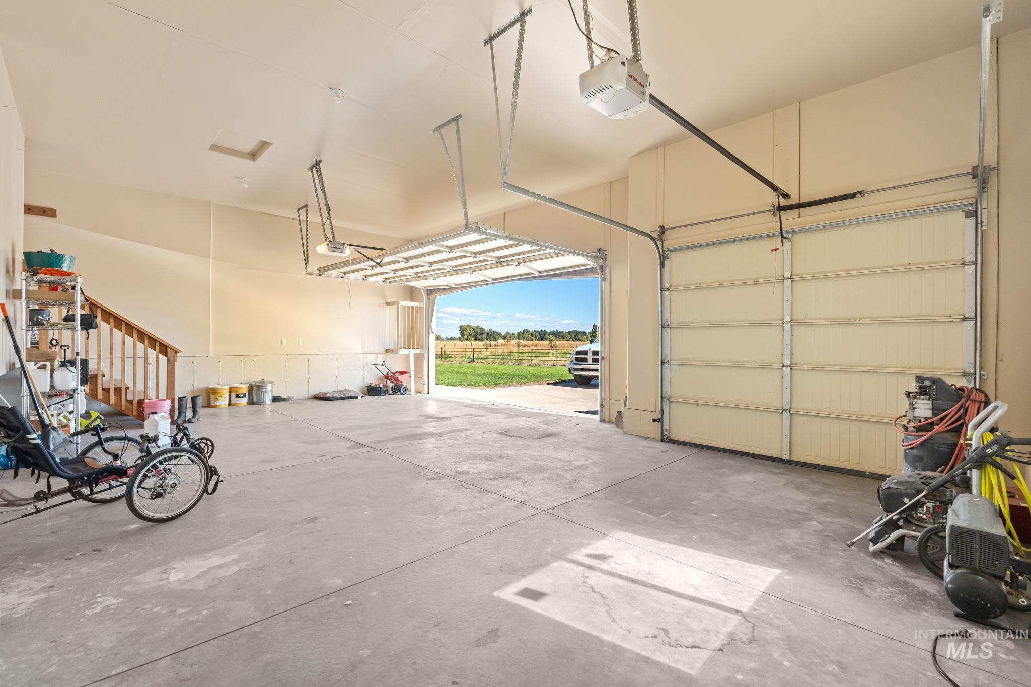 3625 North 2000 West Rexburg, ID 83440 - Photo 6 of 50 Garage with a garage door opener