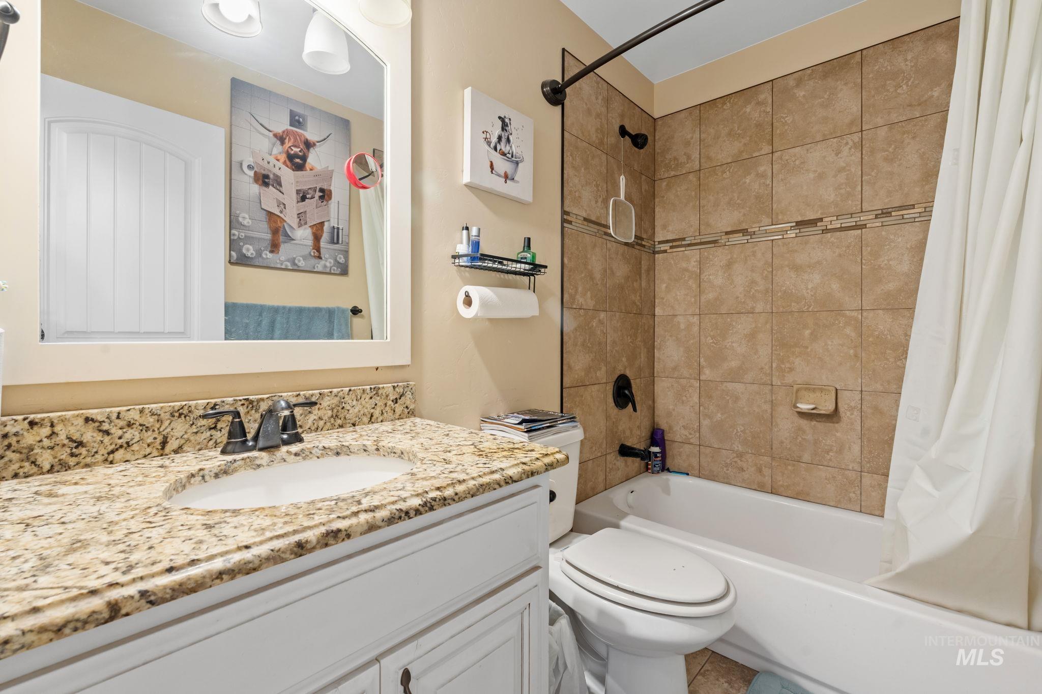 3625 North 2000 West Rexburg, ID 83440 - Photo 10 of 50 Bathroom featuring shower / bath combo and vanity