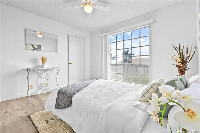 a bathroom with a sink a toilet a mirror and shower curtain