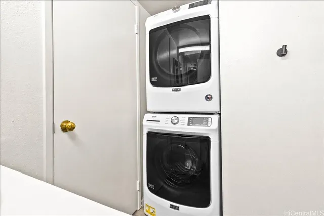 a bedroom with a bed and a mirror