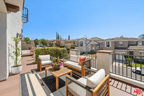 a view of a terrace with couches and a table
