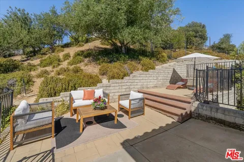 a workspace with furniture and window
