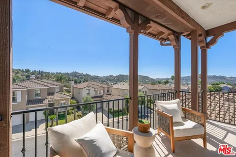a spacious bathroom with a double vanity sink and a mirror
